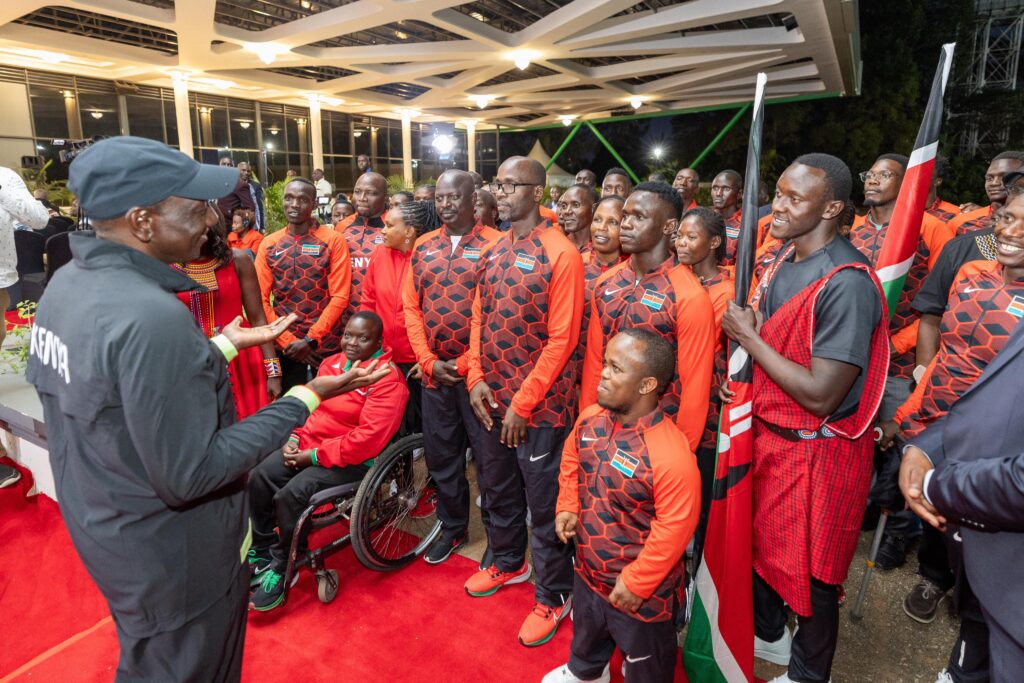 President William Ruto talking to members of the National Olympics team