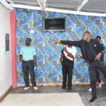 Nakuru County Chief Officer for Youth, Sports, and Talent, Alex Maina playing darts