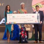 Pwani Oil's Head of Marketing, Caroline Ntinyari (L), and Pwani Oil's Commercial Director, Rajul Malde (R), present a KES 100,000 cheque to Miss Earth Kenya 2024, Faith Wanyama, during the pageant gala at the Argyle Grand Hotel in Nairobi. In addition to the cash prize, and a three-month internship with Pwani Oil Products Limited, Ms. Wanyama is now an ambassador of the Afrisense Luxury Bathing Soap.