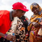 Save the Children Ambassador Sir Mo Farah meets Aisha* and her malnourished son Hassan*