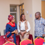 Kisumu County Executive Committee Member (CECM) for Trade, Tourism, Industry and Marketing Ms. Farida Salim (R) receives Magical Kenya marketing materials from the Kenya Tourism Board (KTB) Deputy Director PR & Corporate Communications Ms. Wausi Walya at the close of a capacity building session for taxi drivers in Kisumu.