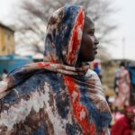 Sudanese woman fleeing conflict